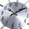 A silver modern cutlery 3D wall clock showing the time.