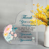 Clear acrylic heart-shaped sign with blue script saying Thank you for the amazing person you are and the difference you make.