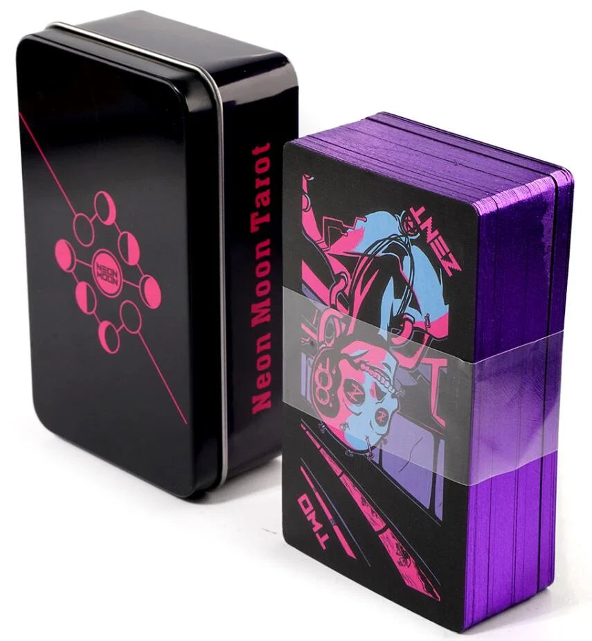 A black box of Neon Moon Tarot featuring a pink symbol next to a purple box of tarot cards.