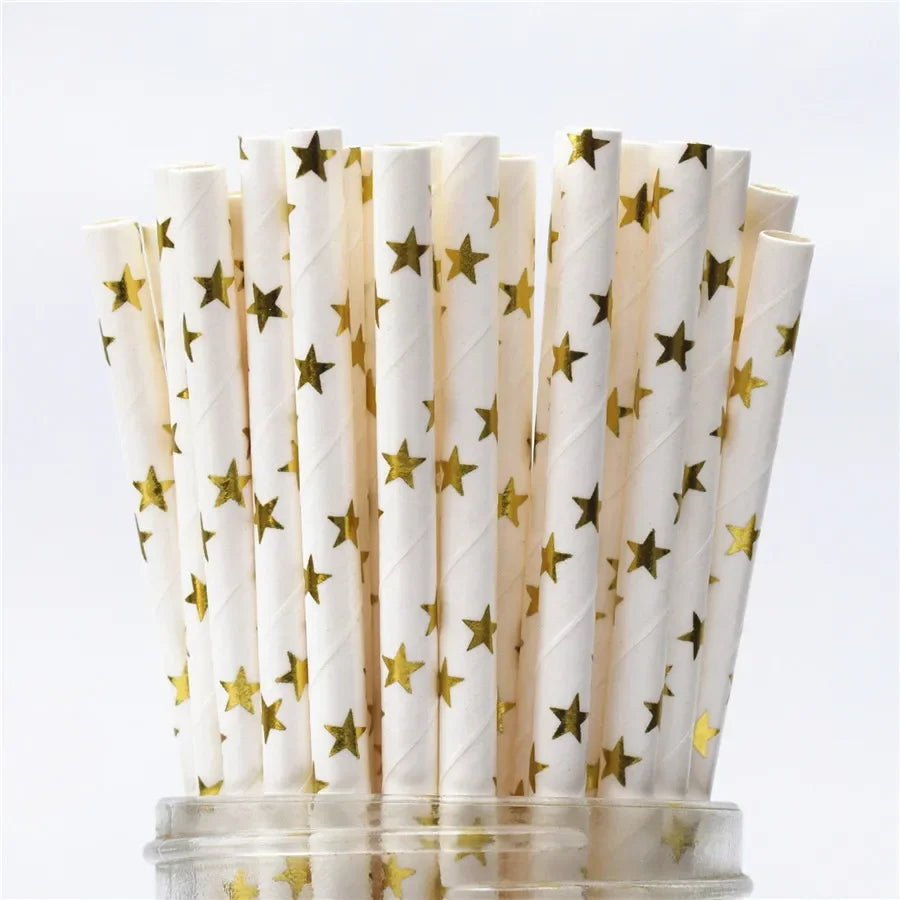 A pack of white drinking straws decorated with gold stars and polka dots