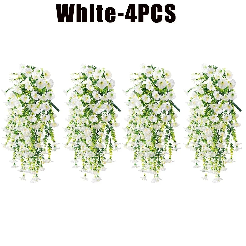 Four bunches of white artificial morning glory hanging vines used for floral decoration