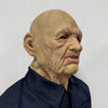 A realistic latex mask of an old man with wrinkled skin and a long neck, shown against a white background.