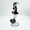Acrylic keychain set featuring an anime character pendant of a girl with dark hair and a black outfit.