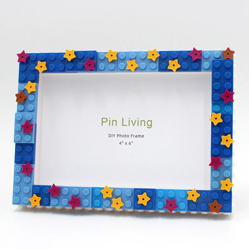 A square photo frame made from blue and yellow decorative blocks with star accents.