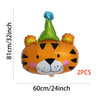 Two orange and green foil balloons shaped like a tiger head for parties