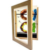 A wooden frame displaying magnetic front opening art with colorful abstract shapes.