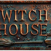 A vintage metal tin sign featuring the words WITCH HOUSE and a broom and cauldron design.
