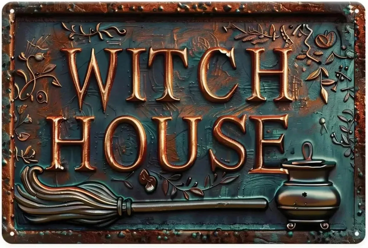 A vintage metal tin sign featuring the words WITCH HOUSE and a broom and cauldron design.