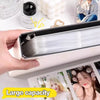 A hand holds a large capacity grid binder for photocard collection with multiple photo pages visible.
