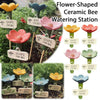 Flower-shaped ceramic bee watering station with various colors and designs for bees