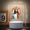 A square 3D LED night light featuring a depiction of Jesus on a cross surrounded by flowers.