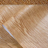 Roll of self-adhesive PVC wallpaper film featuring a natural wood grain texture.