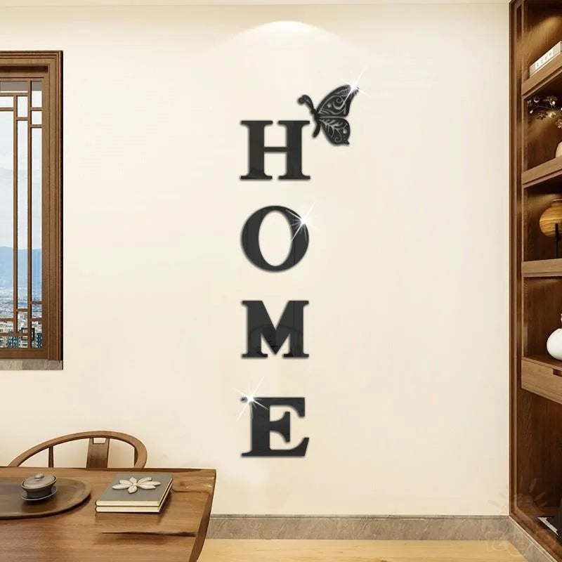 A wall decal featuring the word HOME in large letters with a butterfly silhouette above it.