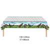 A banner featuring dinosaurs across the top of a rectangular table cloth or backdrop.