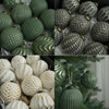 A collection of retro shatterproof Christmas tree ball ornaments in various shades of green and gold.