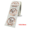 Roll of gold foil thank you sealing stickers with floral designs for envelopes and gifts