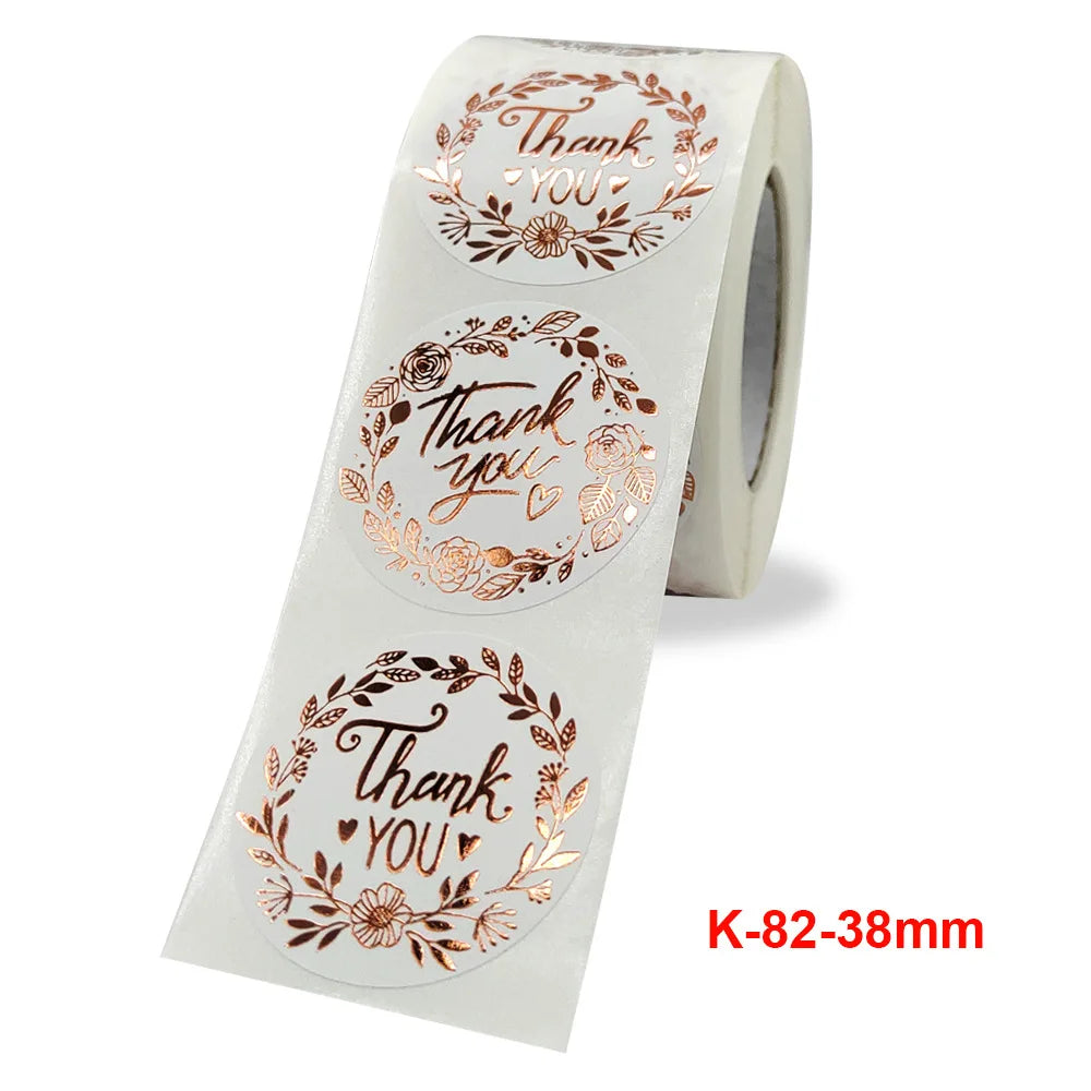 Roll of gold foil thank you sealing stickers with floral designs for envelopes and gifts