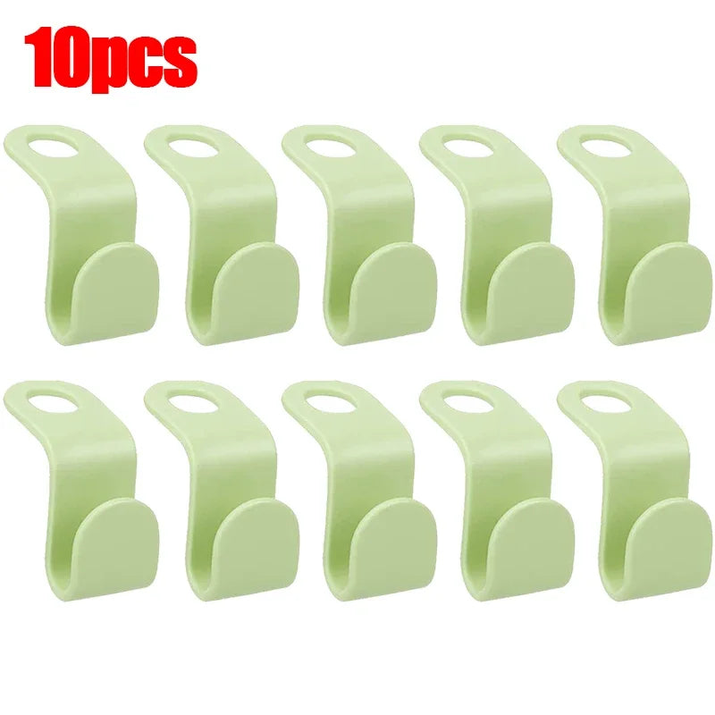A set of 10 light green space-saving hanger connector hooks.