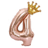 Rose gold foil balloon shaped like the number 4 with a gold crown on top
