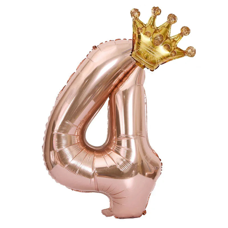 Rose gold foil balloon shaped like the number 4 with a gold crown on top