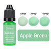 A bottle of Apple Green liquid colorant with dropper tips for candle wax and soap making