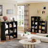 A modern black wooden storage organizer bookcase with open shelves and various storage boxes in a living room setting.