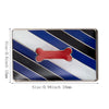 A rectangular lapel pin featuring diagonal stripes of blue, black, and white with a red bone shape in the center.