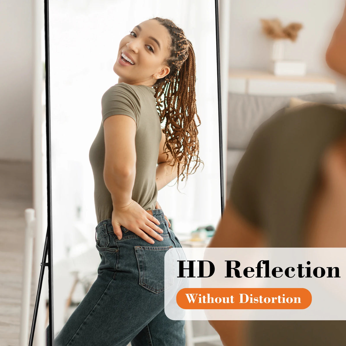 A woman is reflected in an HD reflection on a floor mirror, showing her full body and clothing.