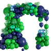 A vibrant balloon arch set featuring green and purple balloons arranged in an arch shape.