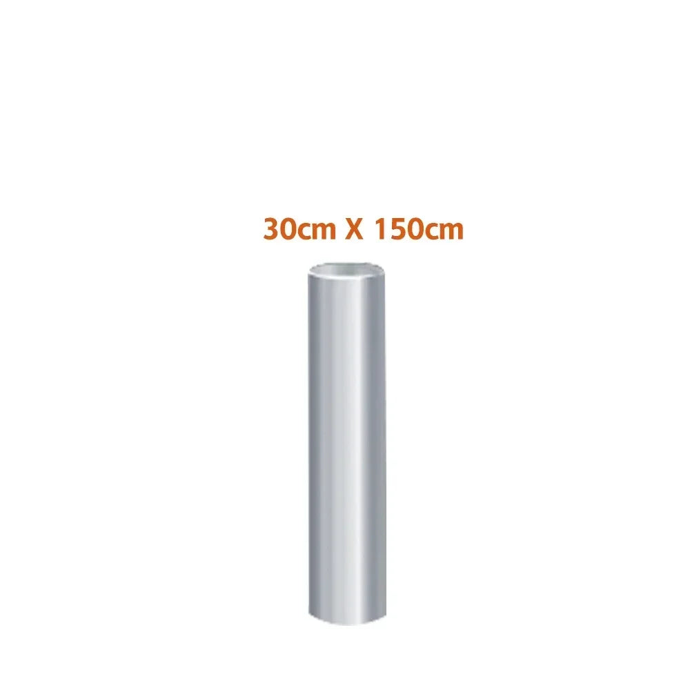 A cylindrical roll of transparent PVC furniture protector film for scratch-resistant self-adhesive vinyl wrap.