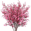 A bouquet of pink cherry blossoms and white gypsophila artificial flowers.