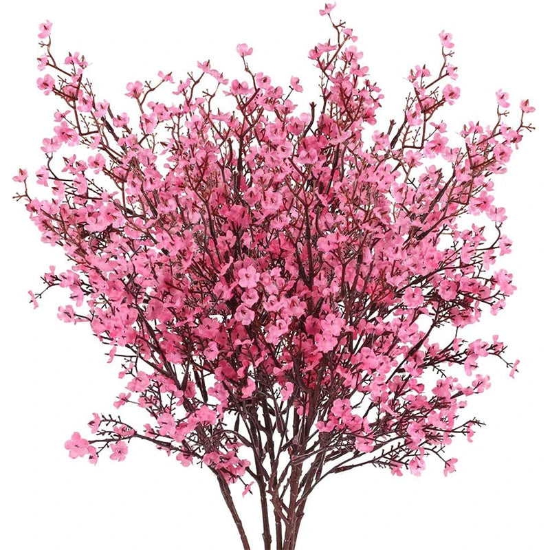 A bouquet of pink cherry blossoms and white gypsophila artificial flowers.