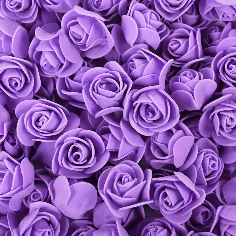 A close-up view of a bulk pack of realistic purple foam rose flowers.