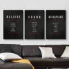 Three framed motivational canvas prints titled Believe Focus and Discipline displayed on a white wall.