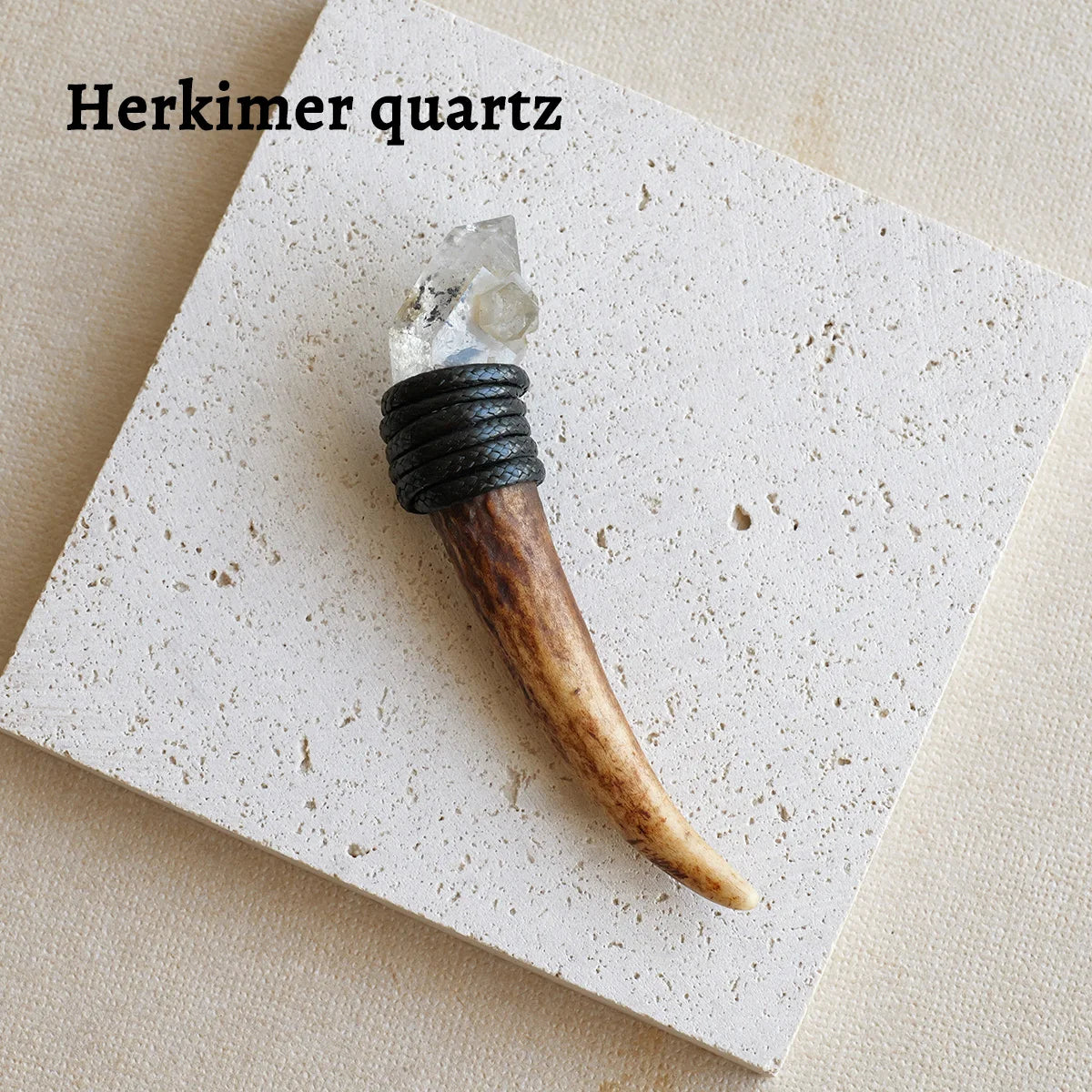 A natural crystal Herkimer scepter wand featuring a clear quartz point and a dark wooden handle.