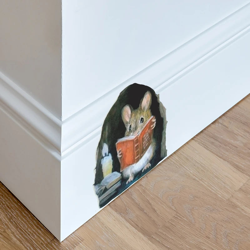 A watercolor illustration of a mouse reading a book, used as a wall sticker.