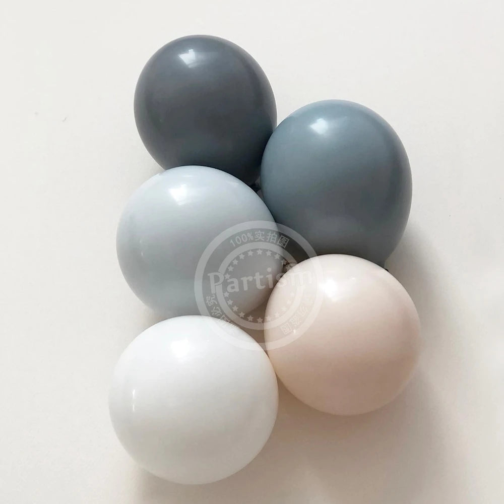 A set of five vintage blue latex balloons in varying shades of gray and white.