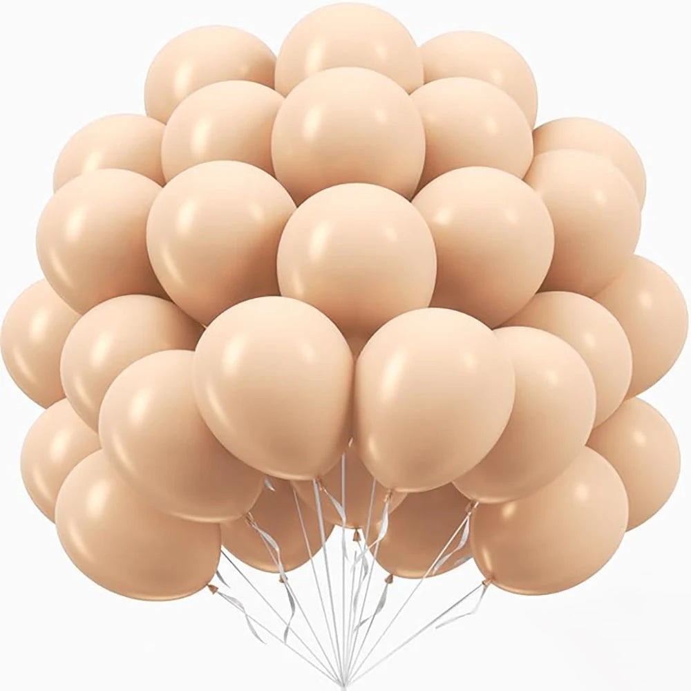 A bunch of light peach and beige pastel latex balloons tied together for party decorations.