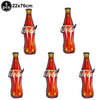 Set of five red glass or plastic tiki-style sunglasses and table mats for a luau party
