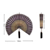Handwoven bamboo wall fan decor with a pleated fan and tassel