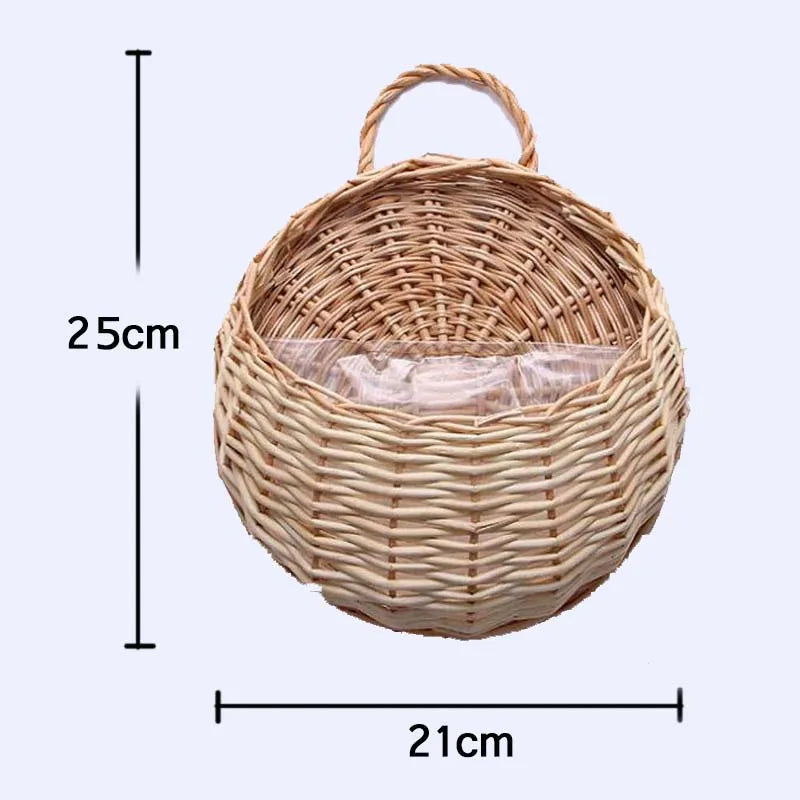 A woven natural fiber wall hanging basket with a round shape and a handle.