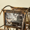 A vintage resin rotating photo frame with an ornate gold-toned metal stand displaying a photograph.