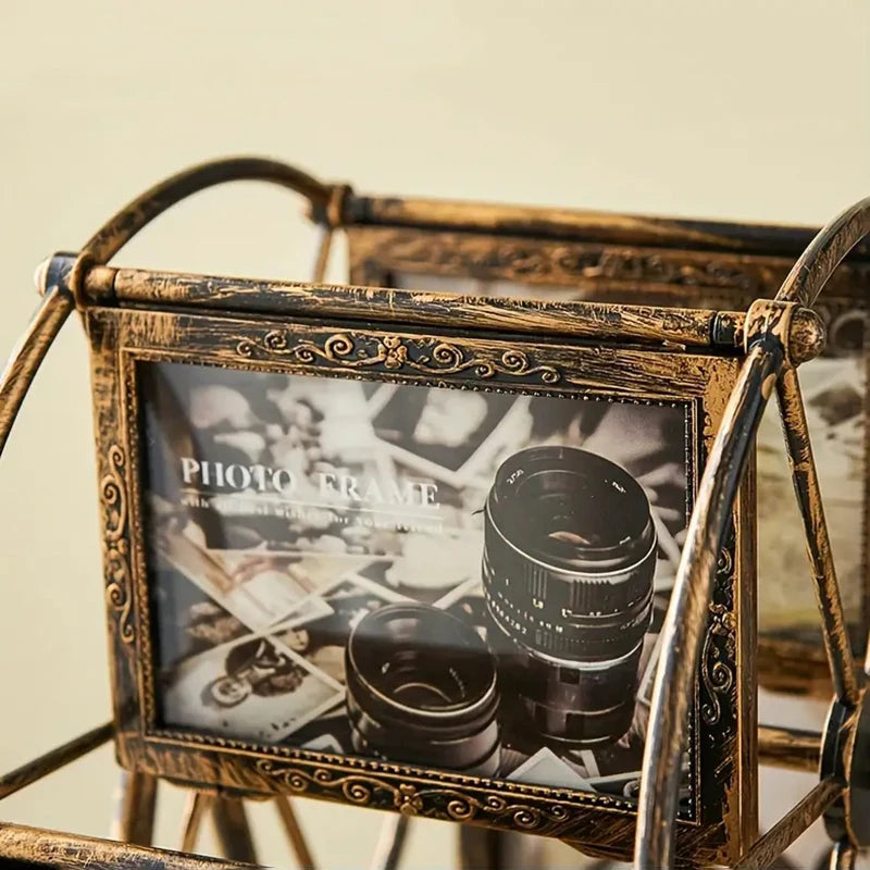 A vintage resin rotating photo frame with an ornate gold-toned metal stand displaying a photograph.
