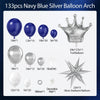 A collection of navy blue and silver balloons, including balloons, a crown, and a starburst balloon.
