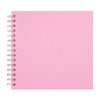 A blank pink spiral-bound notebook or scrapbook album.