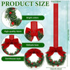 Set of four mini Christmas wreaths with ribbon bows and red berries, featuring a vertical red ribbon.