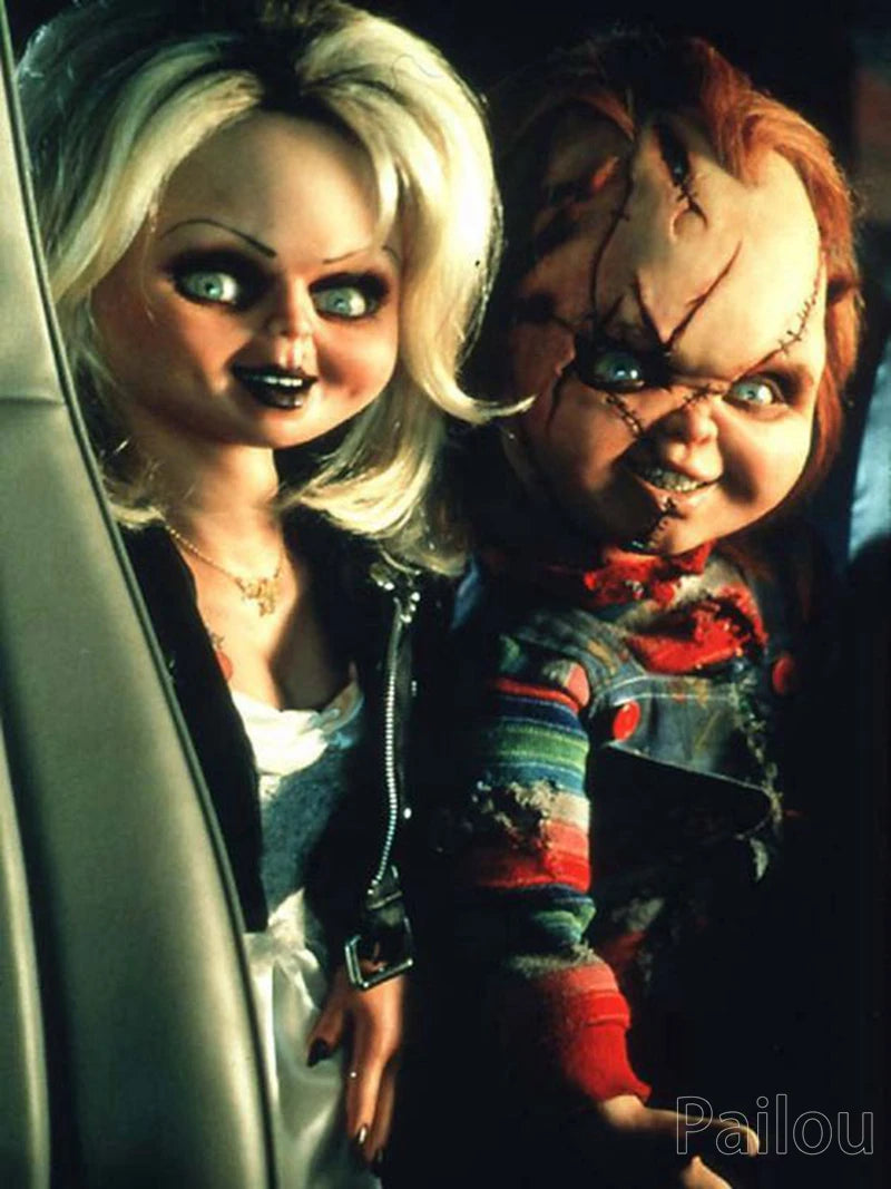 A close-up photo of a doll resembling Chucky, with pale skin and red hair, looking intensely at the camera.