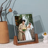 A walnut wood and acrylic photo frame displaying a portrait of a bride and groom.