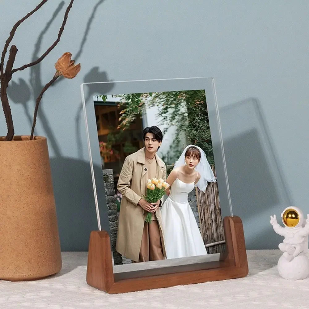 A walnut wood and acrylic photo frame displaying a portrait of a bride and groom.