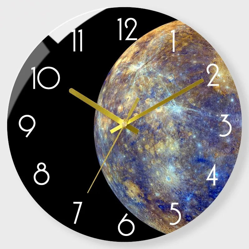 A round clock face features a depiction of a swirling blue and gold nebula or galaxy as the background.